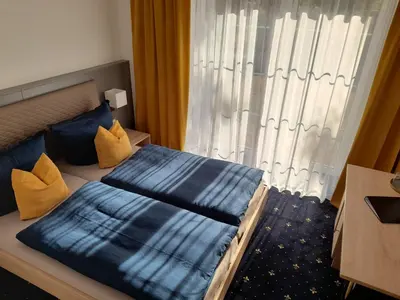 Ein Bett oder Betten in einem Zimmer der Unterkunft Gästehaus Weinberge