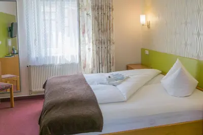 Ein Bett oder Betten in einem Zimmer der Unterkunft Hotel zur Post in Wurzen