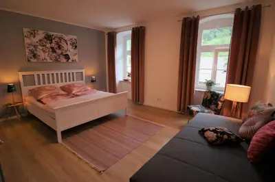 Ein Bett oder Betten in einem Zimmer der Unterkunft Ferienwohnung zum Bielatal