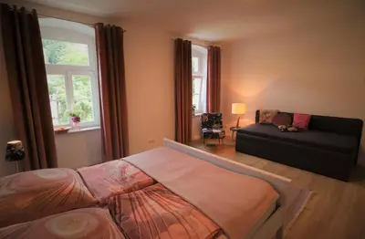 Ein Bett oder Betten in einem Zimmer der Unterkunft Ferienwohnung zum Bielatal