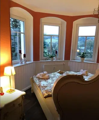 Ein Bett oder Betten in einem Zimmer der Unterkunft Villa Hainberg