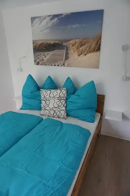 Ein Bett oder Betten in einem Zimmer der Unterkunft Ferienwohnung Lorbeer