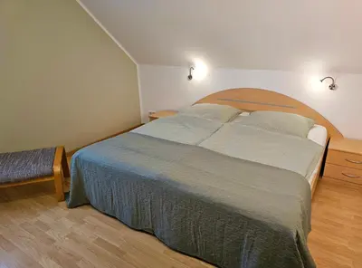 Ein Bett oder Betten in einem Zimmer der Unterkunft Ferienhaus Villa Maria - Ferienwohnung Chippendale