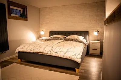 Ein Bett oder Betten in einem Zimmer der Unterkunft Unterschlupf Radeberg mit Garten & Whirlpool