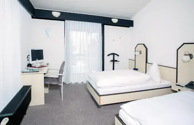 Ein Bett oder Betten in einem Zimmer der Unterkunft Hotel Abendroth