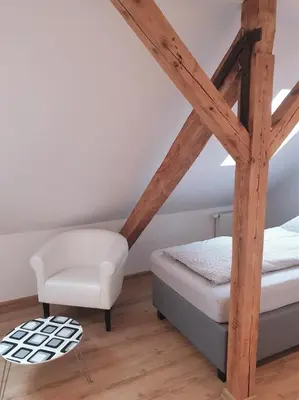 Ein Bett oder Betten in einem Zimmer der Unterkunft Vogelnest Riesa