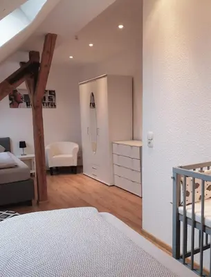 Ein Bett oder Betten in einem Zimmer der Unterkunft Vogelnest Riesa