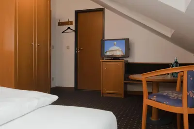 Ein Bett oder Betten in einem Zimmer der Unterkunft Hotel Alekto