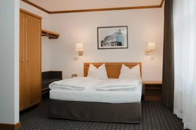 Ein Bett oder Betten in einem Zimmer der Unterkunft Hotel Alekto