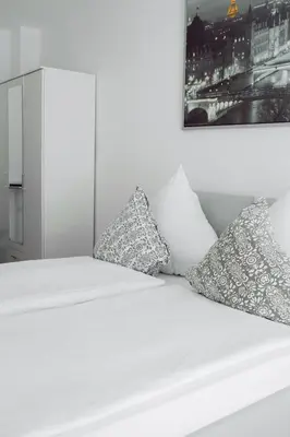 Ein Bett oder Betten in einem Zimmer der Unterkunft Zentral, ruhig, 4Personen, Balkon, Waschmaschine