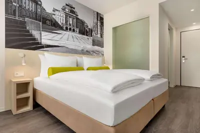 Ein Bett oder Betten in einem Zimmer der Unterkunft Super 8 by Wyndham Chemnitz