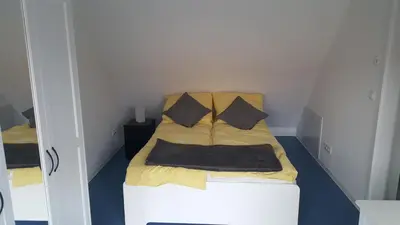 Ein Bett oder Betten in einem Zimmer der Unterkunft Ferienwohnung auf dem Bauernhof