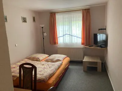 Ein Bett oder Betten in einem Zimmer der Unterkunft Pension Tom´s Hütte