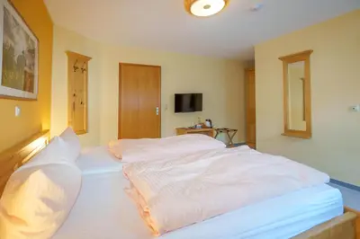 Ein Bett oder Betten in einem Zimmer der Unterkunft Pension Spielzeughof