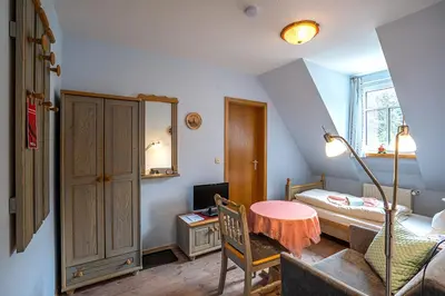 Ein Bett oder Betten in einem Zimmer der Unterkunft Pension Spielzeughof