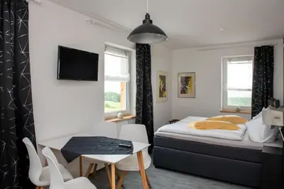 Ein Bett oder Betten in einem Zimmer der Unterkunft Pension Biohof Klügel