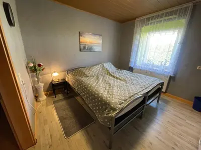 Ein Bett oder Betten in einem Zimmer der Unterkunft Fremdenzimmer Nossen