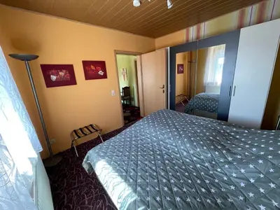 Ein Bett oder Betten in einem Zimmer der Unterkunft Fremdenzimmer Nossen