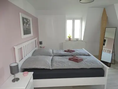 Ein Bett oder Betten in einem Zimmer der Unterkunft Ferienwohnung Sonnenblick