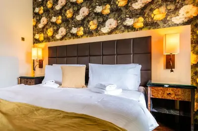 Ein Bett oder Betten in einem Zimmer der Unterkunft Zeitgeist Rathen by STEIGER Hotels