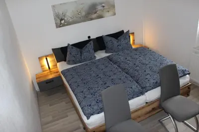 Ein Bett oder Betten in einem Zimmer der Unterkunft Ferienwohnung Löffler Nassau-Erzgebirge