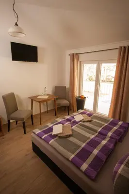 Ein Bett oder Betten in einem Zimmer der Unterkunft Pension Diener