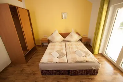 Ein Bett oder Betten in einem Zimmer der Unterkunft Pension Diener