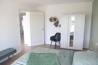 Ein Bett oder Betten in einem Zimmer der Unterkunft Auszeit mit Weitblick in der Sächsischen Schweiz - kleiner Bauernhof mit Tieren und Wallbox