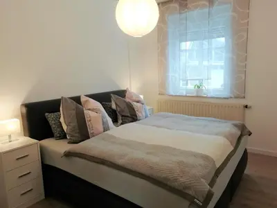 Ein Bett oder Betten in einem Zimmer der Unterkunft Ferienwohnung Ahrens