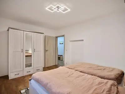 Ein Bett oder Betten in einem Zimmer der Unterkunft Gäste- und Ferienwohnung in der Sportstadt Riesa