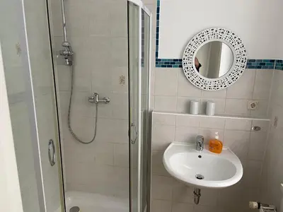 Ein Badezimmer in der Unterkunft Gästehaus Graupner-Hainichen
