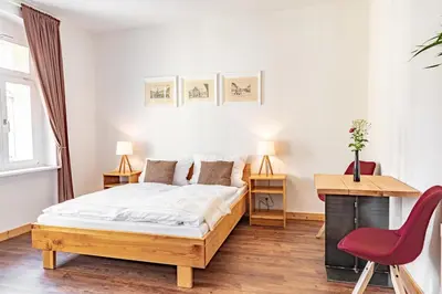 Ein Bett oder Betten in einem Zimmer der Unterkunft Sächsischer Hof
