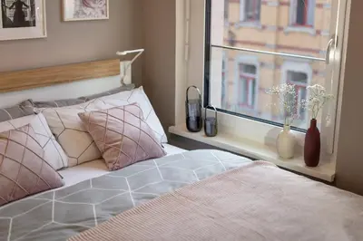 Ein Bett oder Betten in einem Zimmer der Unterkunft SweetHomes Dresden