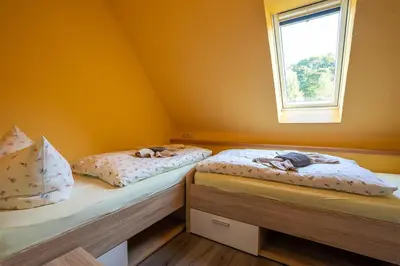 Ein Bett oder Betten in einem Zimmer der Unterkunft Ferienhaus Spielzeughof
