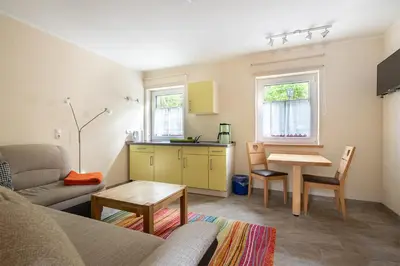 Ein Sitzbereich in der Unterkunft Ferienhaus Spielzeughof