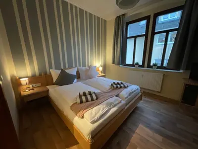Ein Bett oder Betten in einem Zimmer der Unterkunft Pension Lindenhof