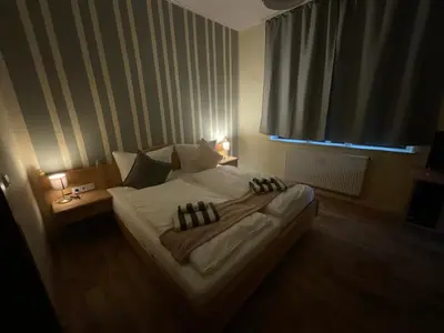 Ein Bett oder Betten in einem Zimmer der Unterkunft Pension Lindenhof