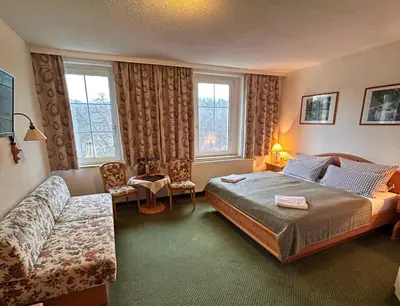 Ein Bett oder Betten in einem Zimmer der Unterkunft Das Muldenschlösschen
