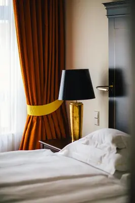Ein Bett oder Betten in einem Zimmer der Unterkunft Relais & Châteaux Bülow Palais