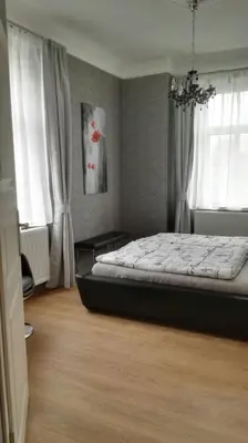 Ein Bett oder Betten in einem Zimmer der Unterkunft FeWo mit 2 Bädern und 2 Schlafzimmern