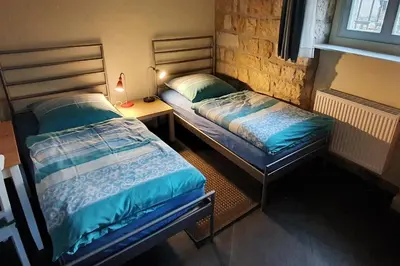 Ein Bett oder Betten in einem Zimmer der Unterkunft Villa Haniel Apartment Leo