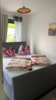 Ein Bett oder Betten in einem Zimmer der Unterkunft Ferienwohnung Pension Sofia