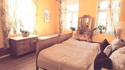 Ein Bett oder Betten in einem Zimmer der Unterkunft Villa Weißbach - Haus Hilda