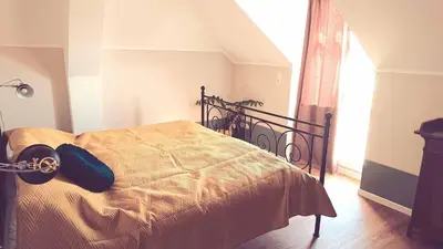 Ein Bett oder Betten in einem Zimmer der Unterkunft Villa Weißbach - Haus Hilda
