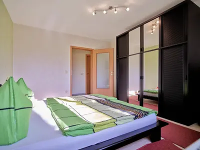 Ein Bett oder Betten in einem Zimmer der Unterkunft Gemütliche Ferienwohnung in ländlicher Lage