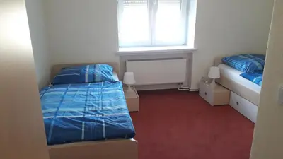 Ein Bett oder Betten in einem Zimmer der Unterkunft Gemütliche Ferienwohnung in ländlicher Lage