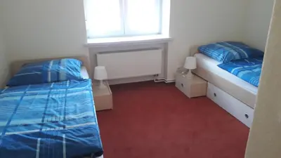 Ein Bett oder Betten in einem Zimmer der Unterkunft Gemütliche Ferienwohnung in ländlicher Lage
