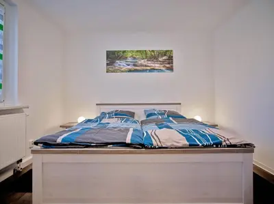 Ein Bett oder Betten in einem Zimmer der Unterkunft Ferienwohnung in der Sportstadt Riesa
