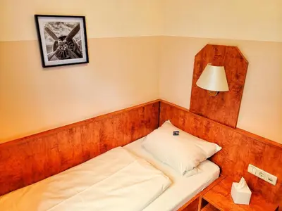 Ein Bett oder Betten in einem Zimmer der Unterkunft Kronprinz Falkenberg
