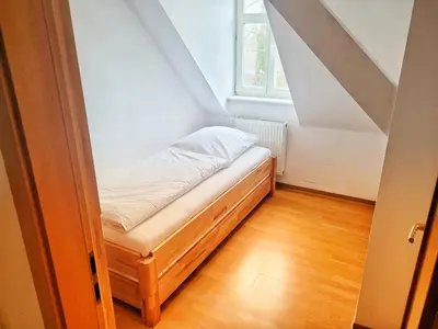 Ein Bett oder Betten in einem Zimmer der Unterkunft Kronprinz Falkenberg